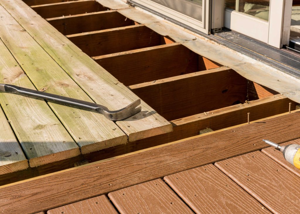 A deck is being repaired on a residential property.